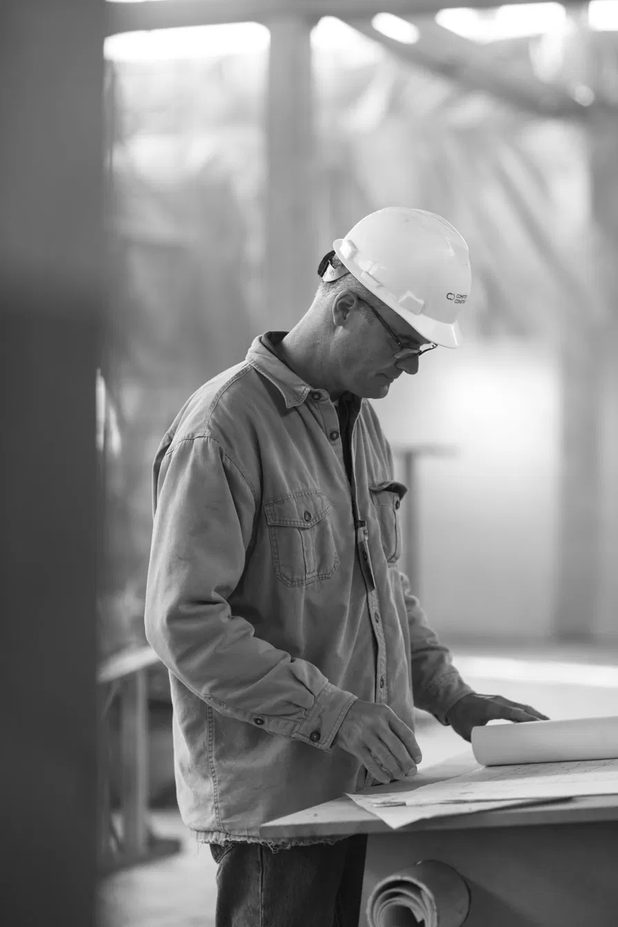 Construction professional reviewing plans